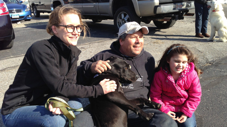 From left, Christine Davies, Greg Mahle, Lylia Davies with Niles the dog.