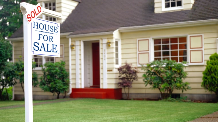 Real estate sign indicating sold house