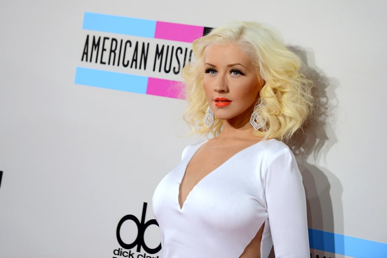 FILE - In this Nov. 24, 2013 file photo, Christina Aguilera arrives at the American Music Awards at the Nokia Theatre L.A. Live, in Los Angeles. On Th...