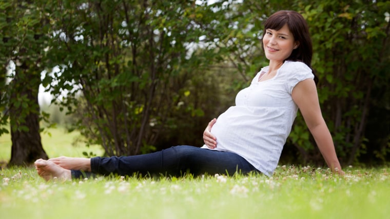Portrait of a pregnant woman in third trimester relaxing in park; Shutterstock ID 114388597; PO: TODAY.com