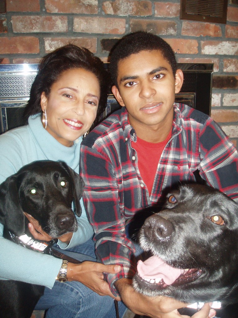 Lori, her son Trey and their two dogs Raven and Raisin.