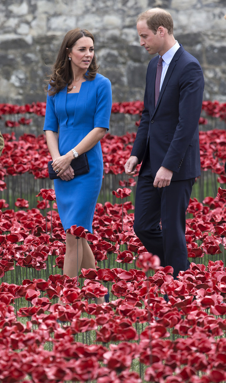 LONDON, ENGLAND - AUGUST 05:  Catherine, Duchess of Cambridge and Prince William, Duke of Cambridge walk through an installation entitled 'Blood Swept...