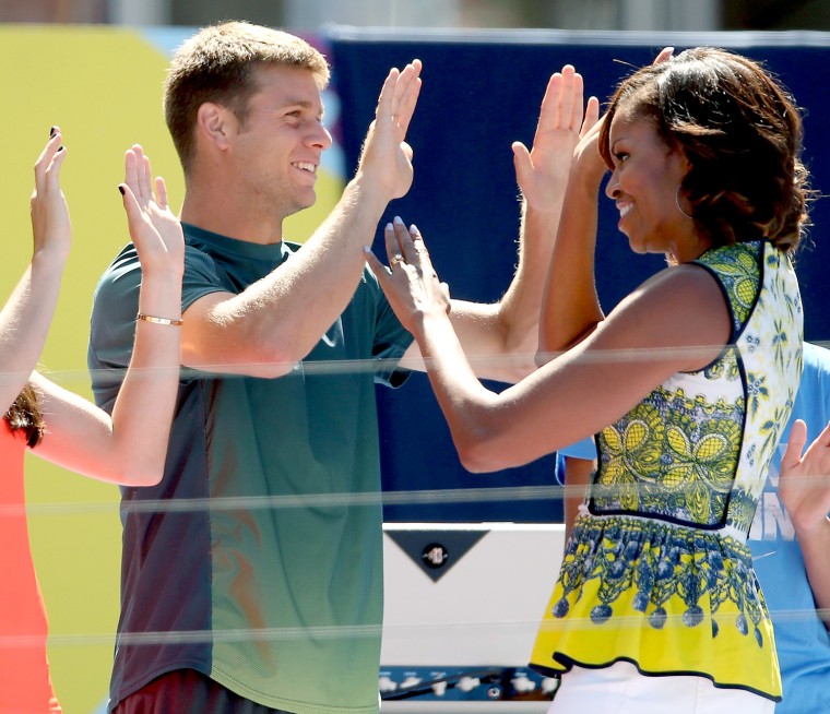 NEW YORK, NY - AUGUST 24:  Christina McHale and Ryan Hsarrison high five with first lady Michelle Obama as she takes the stage to address the crowd ga...