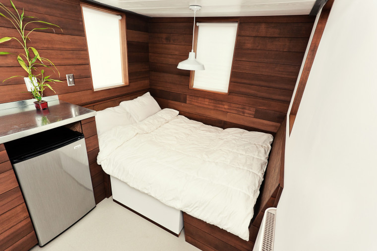 Every inch counts in a tiny house, where a dining room table converts into a bed.