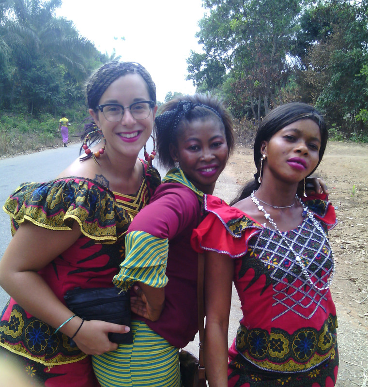 Sara Laskowski with her host-sisters, Djenab and Hadja, celebrating before a local soccer match in Koba, Guinea.