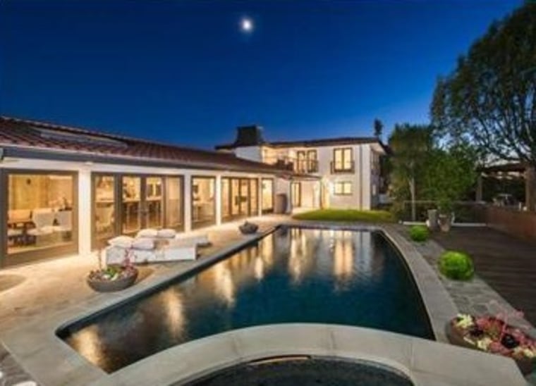 Mila Kunis has listed her home, which features a large entertaining patio around a pool, for $3.995  million.