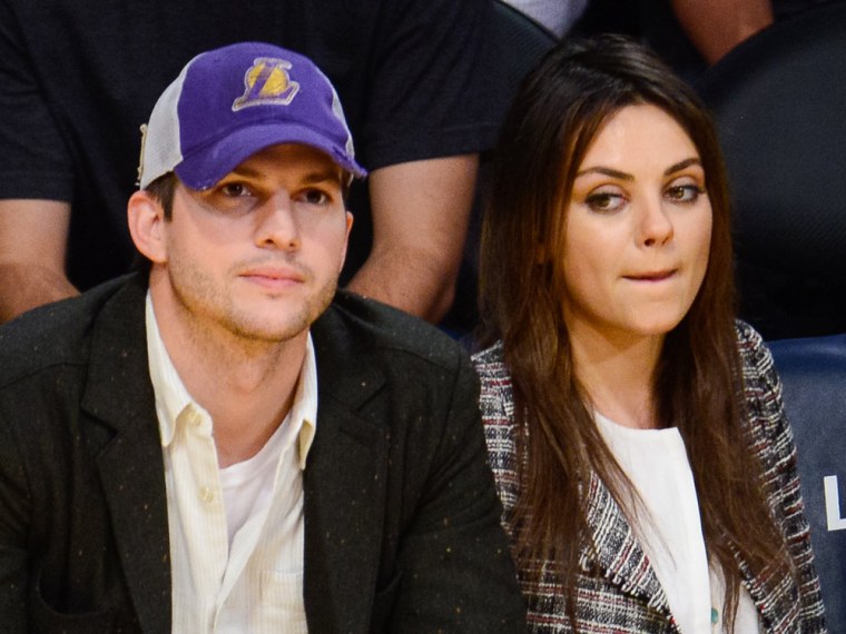Ashton Kutcher and Mila Kunis attend a basketball game between the New Orleans Pelicans and the Los Angeles Lakers at Staples Center on March 4, 2014.