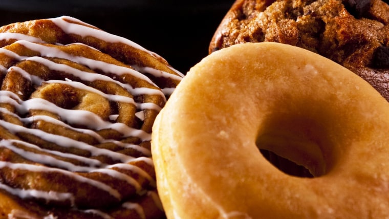 Fresh doughnut and cookies with an espresso