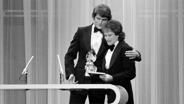 LOS ANGELES - MARCH 8: Christopher Reeve presenting Robin Williams of \"Mork and Mindy\" with the Favorite Male Performer in a New TV Program on the 197...