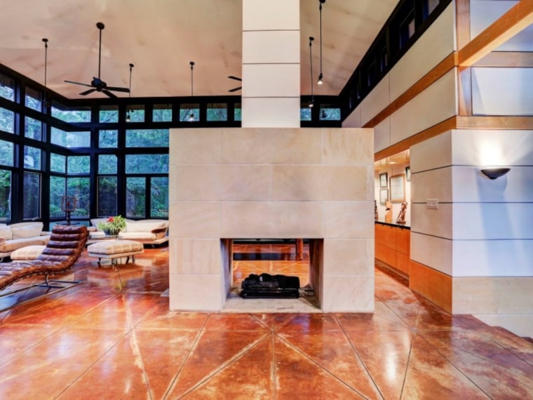 The 1,800-square-foot home carries Frank Lloyd Wright's signature elements: stained concrete floors, concrete-block walls, large windows and natural wood.