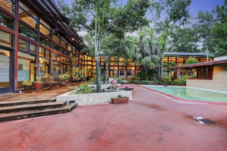 The home's original owner reportedly talked Frank Lloyd Wright out of running the swimming pool into the master bedroom.