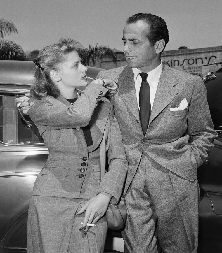 Actress Lauren Bacall gives a toot on a gold whistle attached to her bracelet to let her new husband, Humphrey Bogart, who calls his wife &quot;Baby&q...