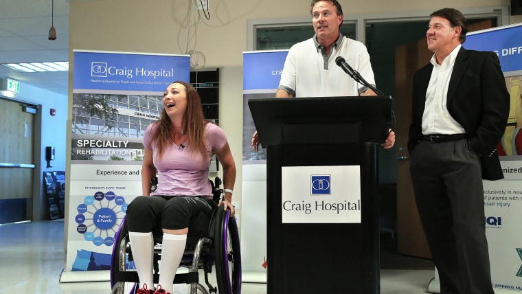 Amy Van Dyken-Rouen sits in her wheelchair beside her husband, Tom Rouen and Craig Hospital CEO Mike Fordyce, as all three talk about her stay at the hospital over the past two months.