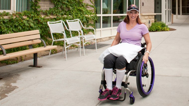 Olympic champion swimmer Amy Van Dyken leaves Craig Hospital in Englewood, Colorado, August 14, 2014. Van Dyken, who was paralyzed from the waist down...