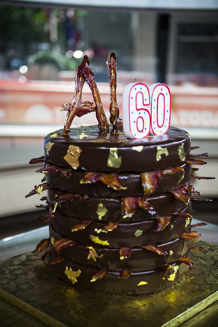 Al Roker receives a birthday cake on his 60th birthday on the TODAY show in New York, on Aug. 20, 2014.