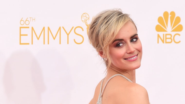 Actress Taylor Schilling  arrives on the red carpet for the 66th Emmy Awards.
