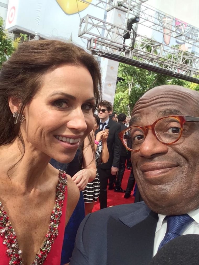 Al Roker and Minnie Driver at the 2014 Emmy Awards.