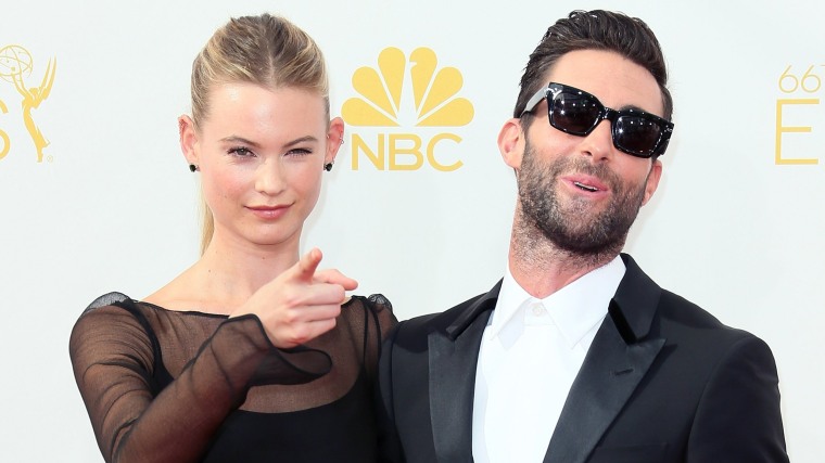 LOS ANGELES, CA - AUGUST 25:  Model Behati Prinsloo (L) and husband singer Adam Levine attend the 66th Annual Primetime Emmy Awards at the Nokia Theat...