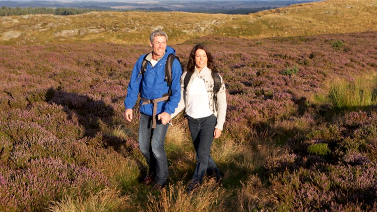 Couple Hiking Across Moorland Covered With Heather; Shutterstock ID 151794929; PO: today.com