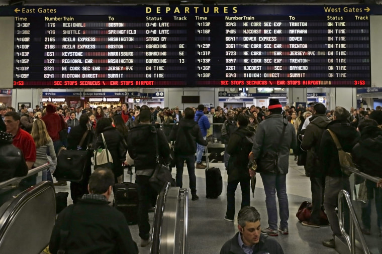 Holiday travelers wait for Amtrak trains, at Penn Station in New York, New York.