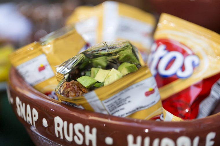 TODAY Show: Sunny Anderson cooks up nacho dogs, root beer chicken and more as she tailgates on the plaza on December 4, 2014.