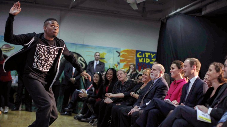 Britain's Prince William, Duke of Cambridge, and his wife, Catherine, Duchess of Cambridge watch Steven Prescod, 22, of Brooklyn, preform an autobiogr...