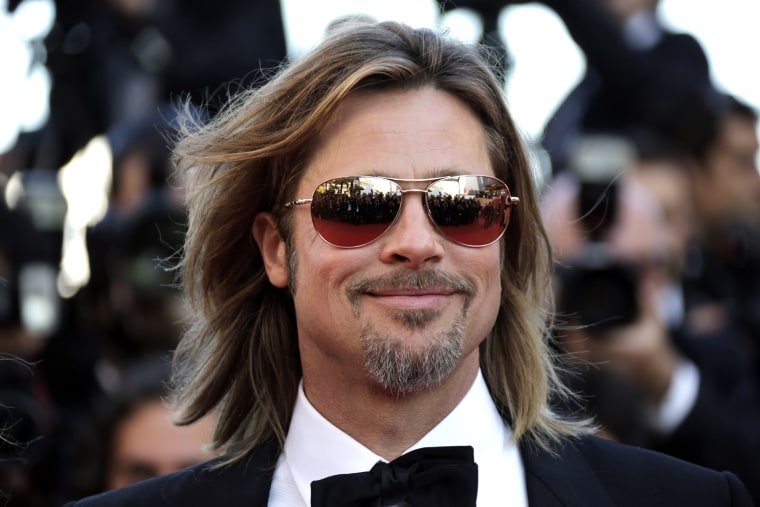 Cast member Brad Pitt poses on the red carpet ahead of the screening of the film \"Killing Them Softly.\"