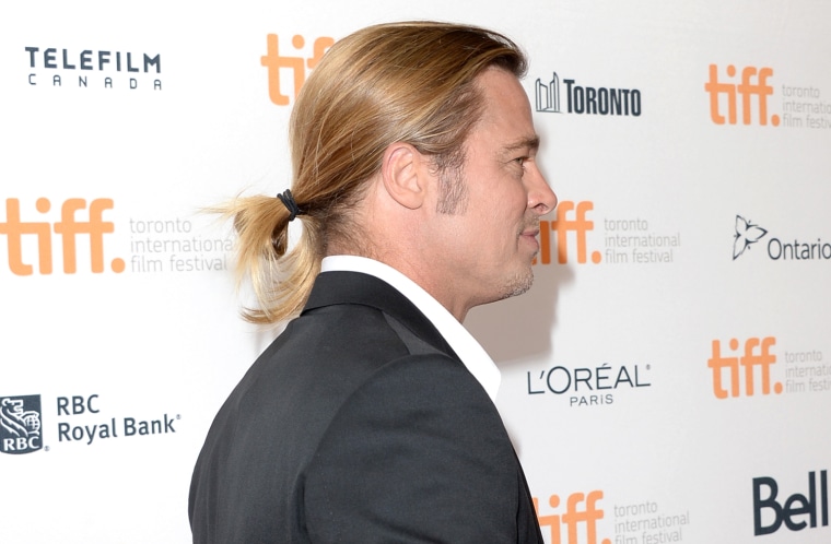 Brad Pitt arrives at the \"12 Years A Slave\" Premiere during the 2013 Toronto International Film Festival.
