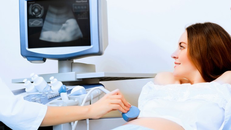pregnant woman and the future father of the doctor's office, ultrasound diagnostics; Shutterstock ID 172643276; PO: TODAY.com