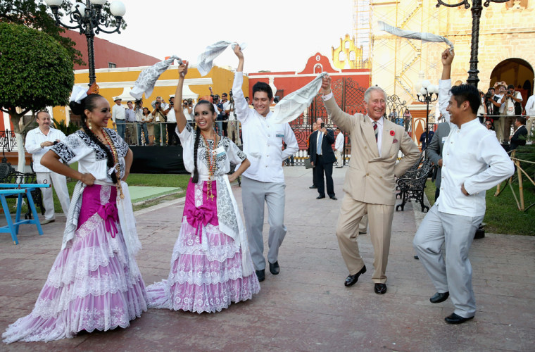 Prince Charles takes part in traditional Mexican clog dancing in Zocalo Square.