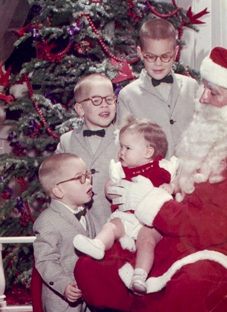 The four Wilson siblings, including young Wendy, gather as a foursome for the Santa pic first time in 1960.