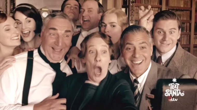 The cast of \"Downton Abbey\" and their new Lord Hollywood (George Clooney) take a selfie in a new video.