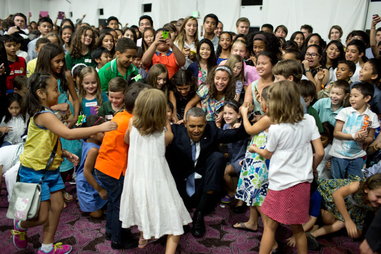 April 28, 2014
\"'Help me up!', the President beckoned after posing for a photograph with children at the U.S. Embassy in Manila, the Philippines.\"
 (O...