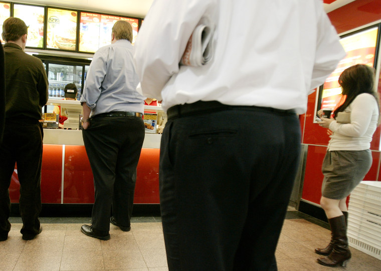 Customers wait for lunch orders at a fast-food outlet in Sydney. The World Health Organization says more than 1 billion adults around the world are overweight and 300 million of them are obese. A new study shows a clear link between obesity and eating fast food.