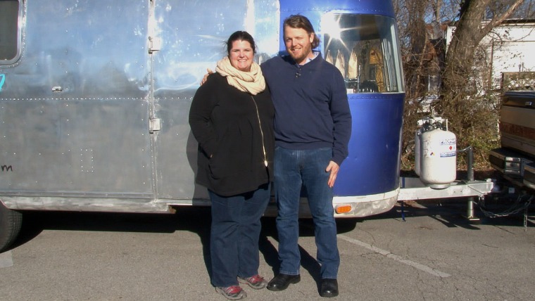 Sarah and Karl Worley pose in front of their small business, the Biscuit Love food truck.