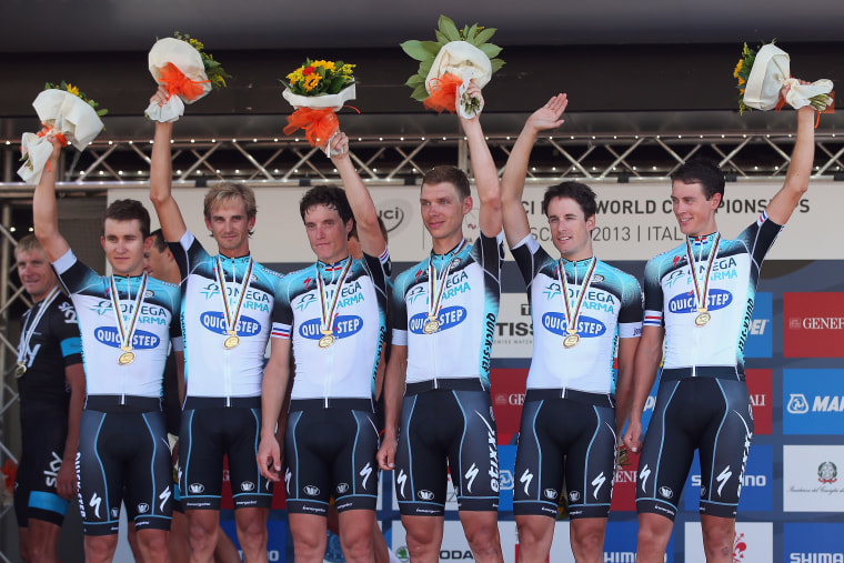 Quick Step riders Michal Kwiatowksi, Peter Velits, Sylvain Chavannel, Tony Martin, Kristof Vandewalle and Niki Terpstra celebrate winning the Elite Men's Team Time Trial on day one of the UCI Road World Championships on Sept. 22, 2013.