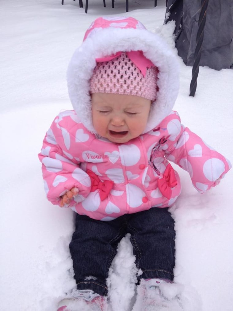 Fan shares a photo of her child unhappy in the snow.