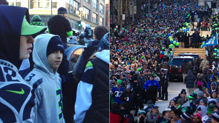 My son, in the number #3 Russell Wilson jersey, soaking in the parade of a lifetime.