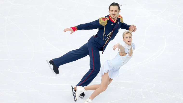 Two skaters compete during the Sochi 2014 Olympics