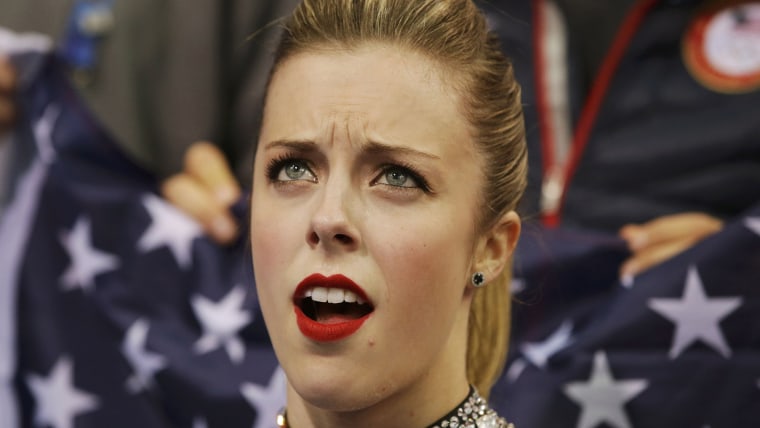 Ashley Wagner of the United States reacts in the "kiss and cry" area during the Team Ladies Short Program at the Sochi 2014 Winter Olympics, February ...