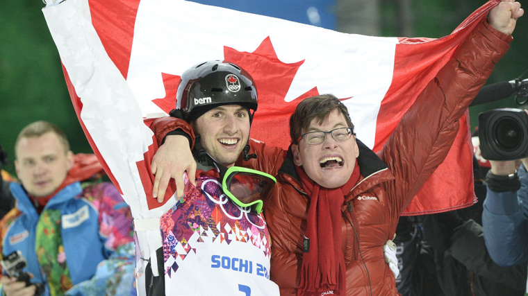 Canada's Alex Bilodeau celebrates his Gold Medal With Brother Frederic at the Men's Freestyle Skiing Moguls final at the Rosa Khutor Extreme Park duri...