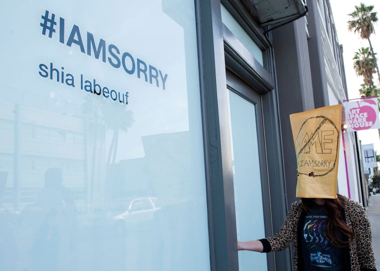People line up one-by-one to see Shia LaBeouf's \"I Am Sorry\" art exhibit.