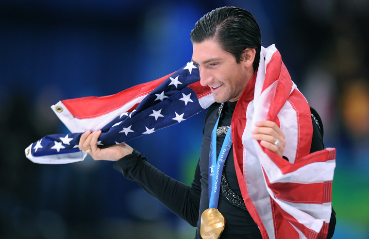 Gold medallist, US Evan Lysacek, does his honour lap after performing in the Men's Figure skating free program at the Pacific Coliseum in Vancouver du...