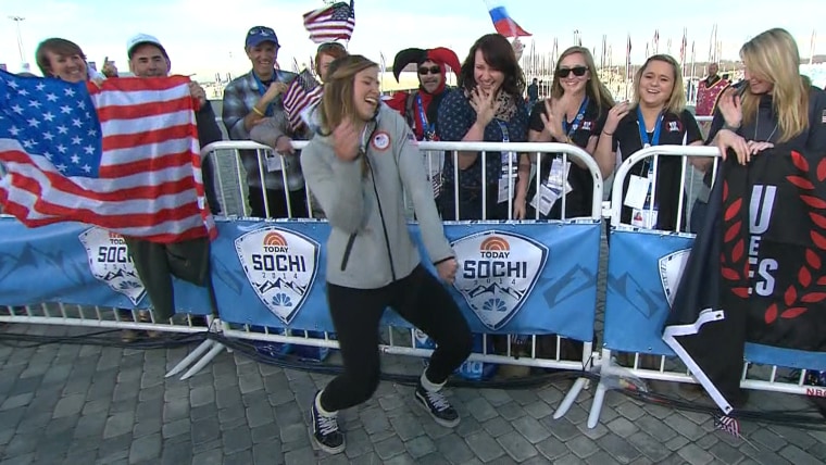 Kate Hansen dances on the Sochi plaza.