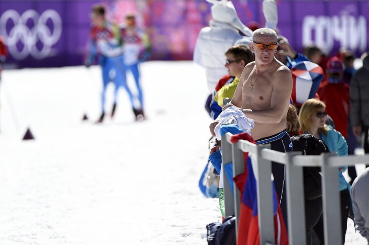 SOCHI, RUSSIA - FEBRUARY 13:  A shirtless fan watches the Women's 10 km Classic during day six of the Sochi 2014 Winter Olympics at Laura Cross-countr...