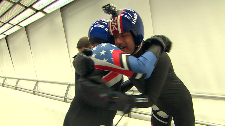 Al Roker and Matt Lauer hug it out after a close call on the luge run.