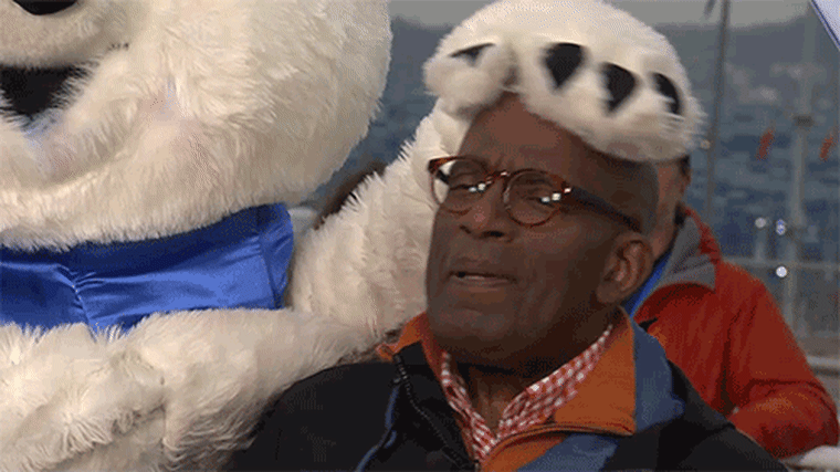 Al gets a furry greeting from Bely Mishka, the Sochi bear mascot.