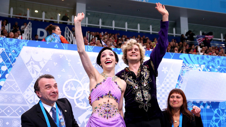 Davis and White wave to fans after competing in the routine that won them gold.