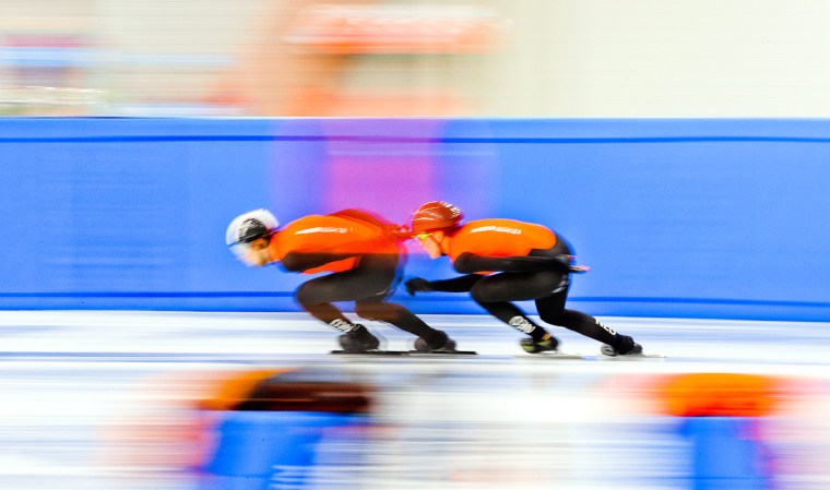 Two short track speed skaters practice in Sochi