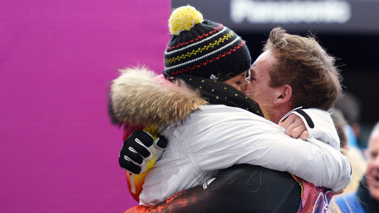 Felix Loch kisses his girlfriend after winning gold at Sochi.